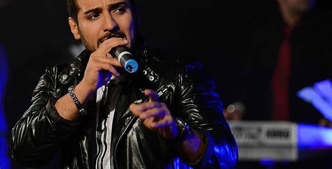 Valy performing live on stage in Auckland with Arash Armand on keyboard, captured on video by HAPfilm.