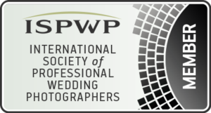 Logo of the International Society of Professional Wedding Photographers (ISPWP), featuring a stylized camera icon with the initials ISPWP in bold, elegant typography.