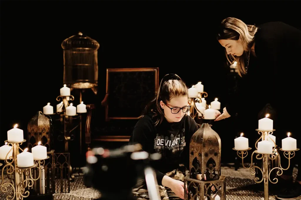 A behind-the-scenes look at the filming of the music video Sarnevesht, showing the HAPfilm crew setting up lighting, cameras, and stage decor with artist Sonbol Taefi on set in Auckland, New Zealand.