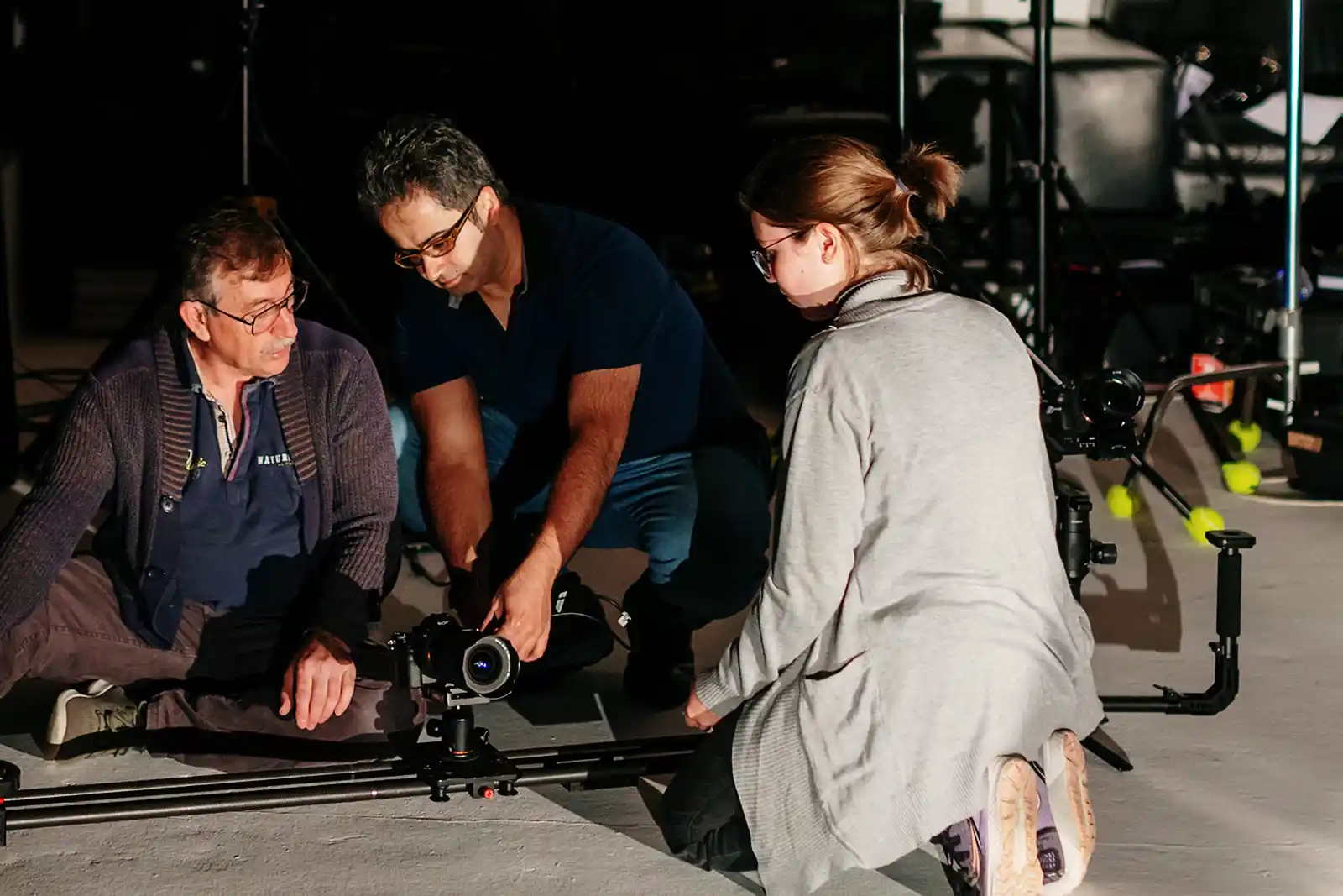 A behind-the-scenes look at the filming of the music video Sarnevesht, showing the HAPfilm crew setting up lighting, cameras, and stage decor with artist Sonbol Taefi on set in Auckland, New Zealand.