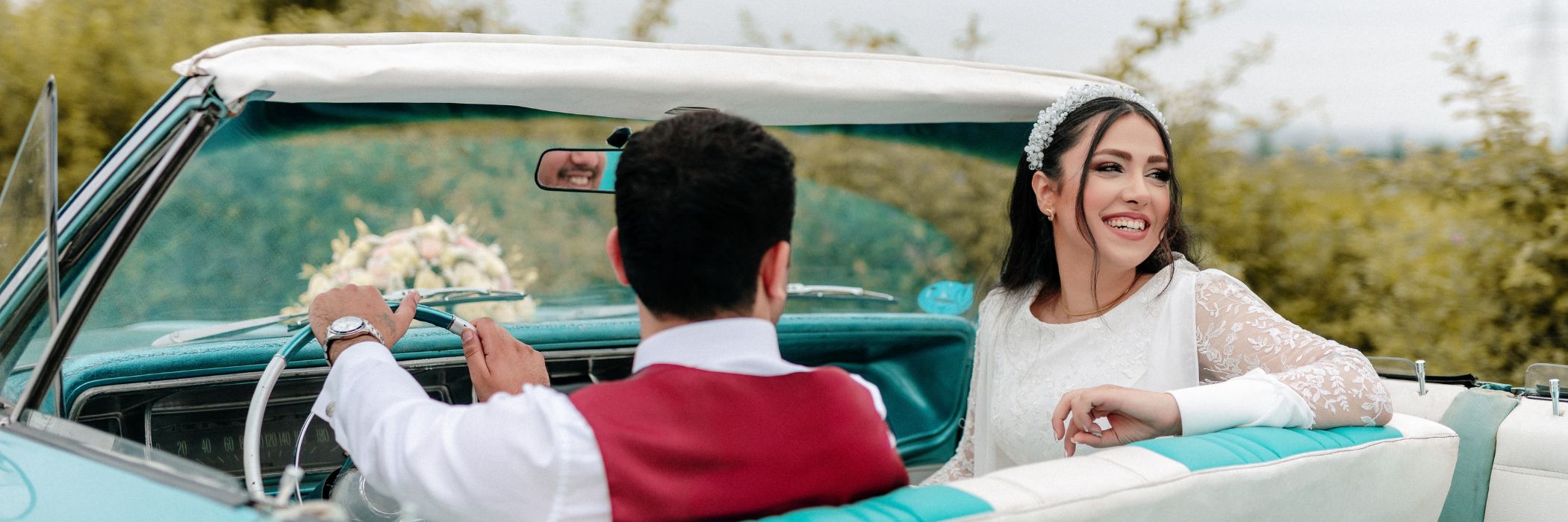 A couple enjoying their wedding day with classic car at a scenic lake, captured by HAPfilm Auckland’s expert wedding photography and videography